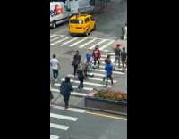 Woman pushing stroller while on hoverboard 