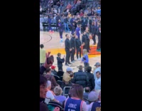 Woman tube top dances inside basketball arena