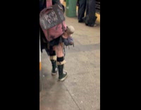 Collab WINY - Woman carries gothic doll at the subway