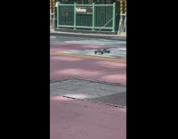 Guy races mini car in crowded road