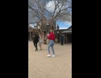 Two girls in old ghost town hold hands video