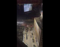 Crowd at car meet watches two cars