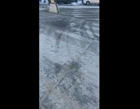 Pink bra hangs from street sign 