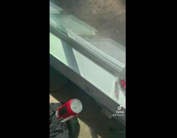 Girl shows empty coke zero can 