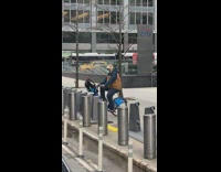 Guy pedals backwards on locked rental bicycle 