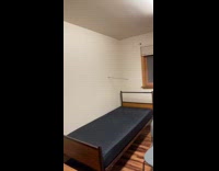 Guy shoots arrow into white wall 