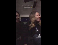 Couple play around with voice activated lights 