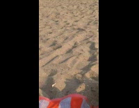 Man wear brown boots walk on beach