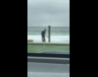 Collab Kook Of The Day - Guy washing his board at the beach shower