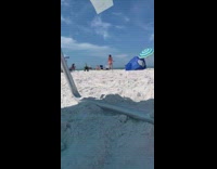 Pink bikini girl dances white beach sand 