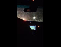 Car drive at night snow fall down