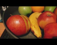 Red apple two yellow striped on side