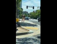 Woman twerks on the sidewalk for video