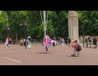 Guy wears british flag and dances in street