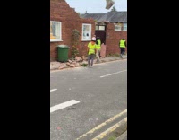 Construction worker throw bricks through the window