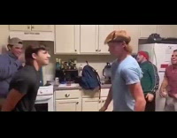 Two guys slap each other in the face multiple times 