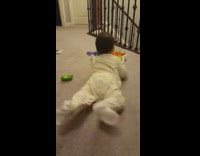 Baby lie down and shakes butt for mother