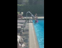 Girl purple bikini read newspaper pool railings