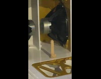 Red car with large white speaker 