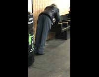man black jacket doing push ups on bench 