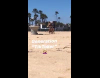 Two girls tiktok dance together beach sand
