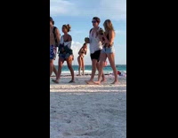 Woman black bikini sandy butt beach