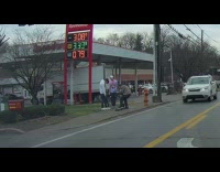 Two men talks with their skateboard near McDonalds