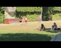 Man flex back muscles park face statue