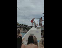 Guy takes shot and backflips off boat 