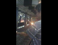 Guy throws and flips phone in air in front of oncoming subway train and catches it in time