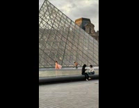 Woman long dress run hold cloth glass pyramid