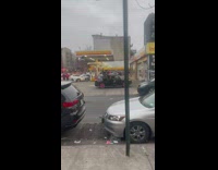 Man pink hat lay over car gasoline station