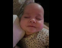 Baby asleep held by dad and then pukes