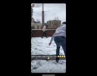 Guy playing snowball fight on rooftop slips in snow