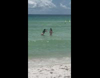 Girl white tube bikini  side beach waves