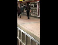 Man wears heels and limps in subway station