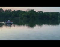 Group of people on raft return ball stuck in water to people on shore