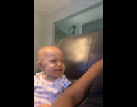 Baby blows raspberry then laughs at it
