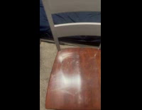 Man shows reflection of butt imprint on chair