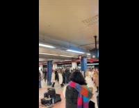 Passengers jamming with performer at subway station