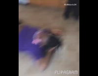 Woman rides hoverboard for the first time in her kitchen and falls off backwards