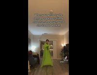 Person dancing in living room with full body sock