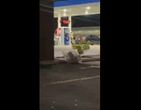 Man and Woman tiktok dance gas station