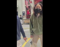 Lady in red twerks on window at fire station 