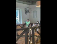 Man takes picture of his food near the window