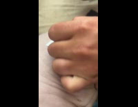 Woman puts temporary tattoo on sphynx cat