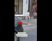 Guy white turtleneck long boots sit bench