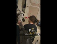 Girl tries to remove white shoe off prosthetic leg 