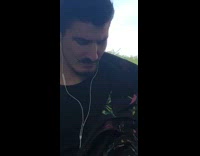 Black jacket guy train mustache extends up 