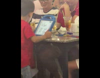 Boy writes when can we go on toy at restaurant 